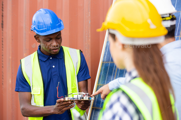 African American worker showing solar cell controller system to business partnership