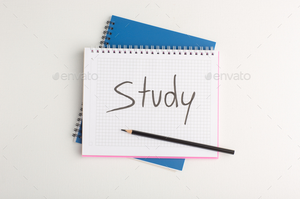 top view open copybook with writings on it on the white background pen copybook notepad