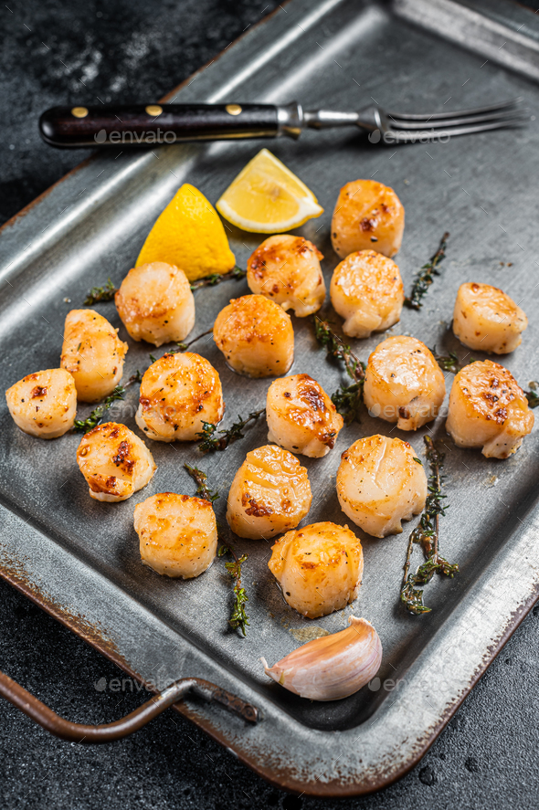 Scallops Poached In A Butter And Garlic Sauce In A Steel Tray With Thyme Black Background Top 2426