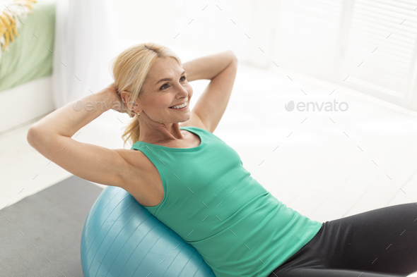 Premium Photo  Woman doing exercises with fitball in fitness gym class.  engaging core abdominal muscles. image concept of healthy lifestyle for  women.