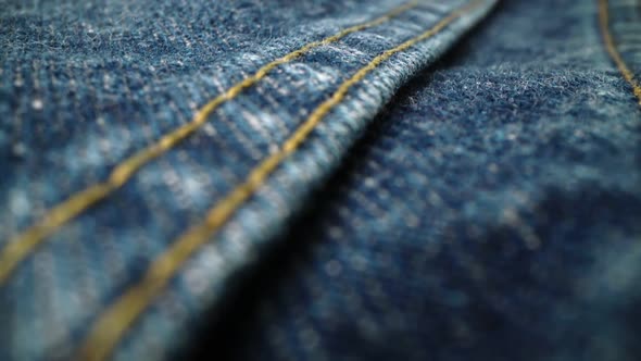 Extreme Detailed of Blue Denim Jeans Texture in Dolly Shot Over Cloth Surface alt