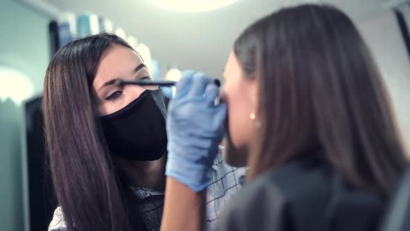 Customer Service in a Beauty Salon Wearing a Protective Mask