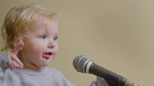 Cute Little Girl Sing Song Into Microphone, Funny Toddler Enjoing Broadcasting