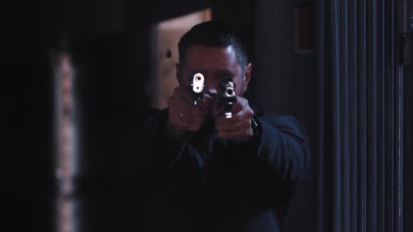 Dangerous Man Shoots From Two Guns Then Looking Over His Pistols alt