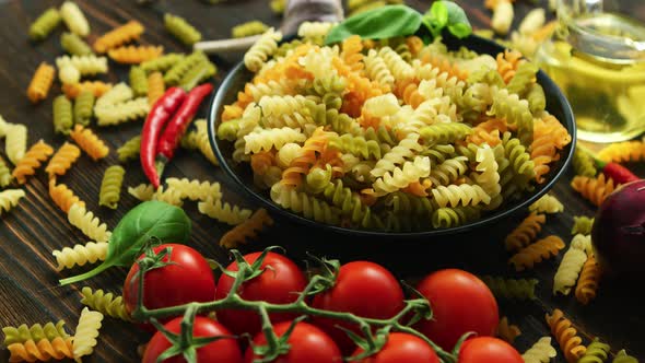 Bowl with Raw Macaroni of Different Color alt
