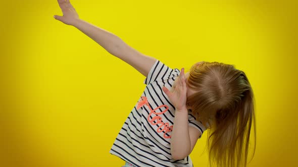 Cheerful Little Kid Child Girl Having Fun Dancing and Moving to Rhythm Dabbing Raising Hands alt