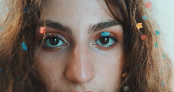 Girl covered in confetti alt