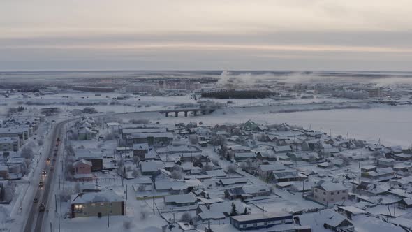 View of the Winter Bridge Across the Frozen River Dividing the City of NaryanMar Into Two Parts