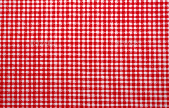 Red and white checkered tablecloth. Top view table cloth texture background. Red gingham pattern