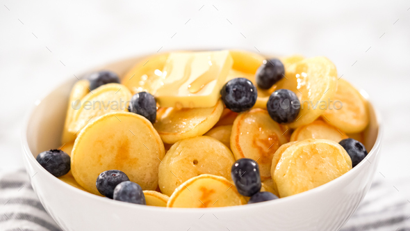 Mini pancake cereal Stock Photo by arina-habich