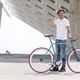 young man using his cellphone while going to work with his bicycle - PhotoDune Item for Sale