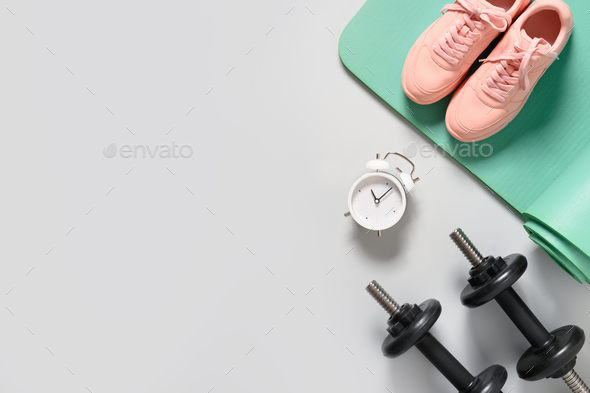 Female sport equipment on a pink background Stock Photo