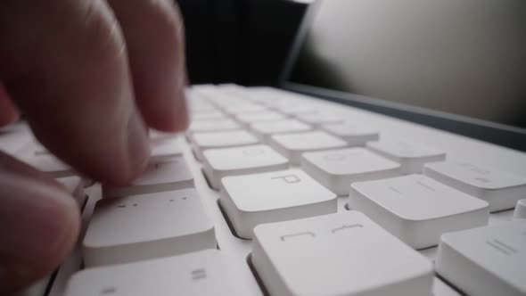 Close-up time lapse typing on keyboard with fingers. Macro soft focus dolly shot alt