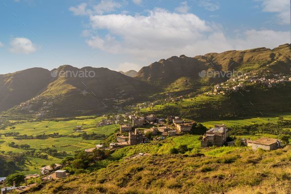 Breathtaking view of the charming village of Ibb, Yemen, nestled among the majestic mountain range - Stock Photo - Images