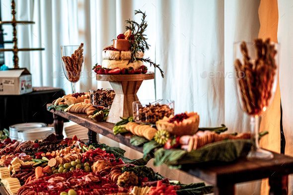 a buffet with different types of food on the table at a formal event