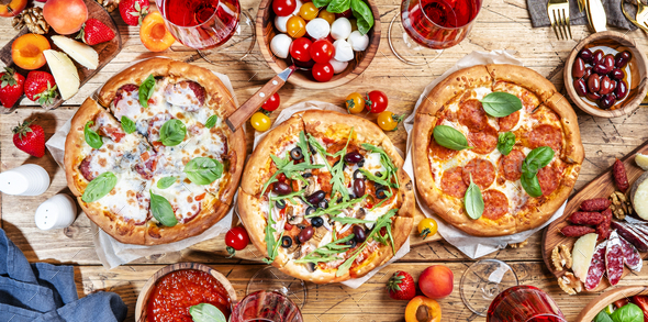 Pizza party table. Top view glasses with red wine, rustic wooden table ...