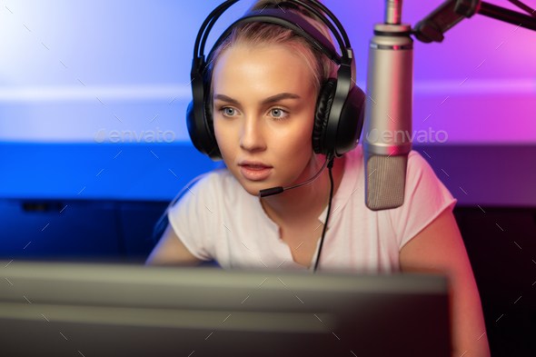 Happy and Beautiful Blonde Gamer Girl Playing Online Video Game on Her  Personal Computer Stock Photo by kjekol