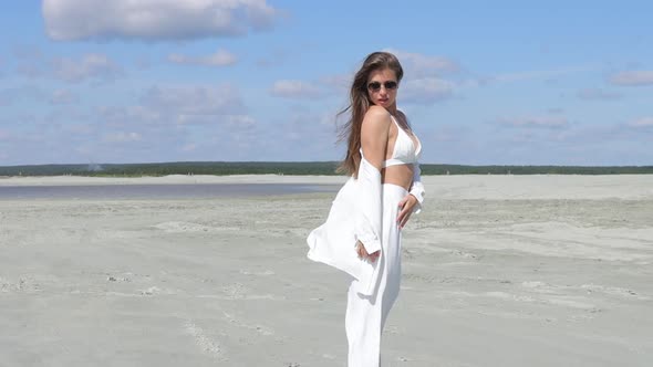 Beautiful Woman Walking on Shore