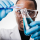 african american scientist in lab working with test tubes and beakers - PhotoDune Item for Sale