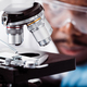 african american scientist in lab working with microscope - PhotoDune Item for Sale