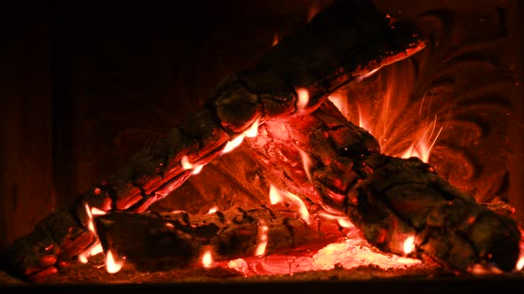 Warm Cozy Burning Fire in a Brick Fireplace Closeup Shot