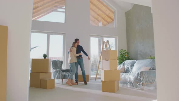 Couple visiting their new house alt