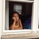 diverse child at home looking out window, lonely bored and sad - PhotoDune Item for Sale