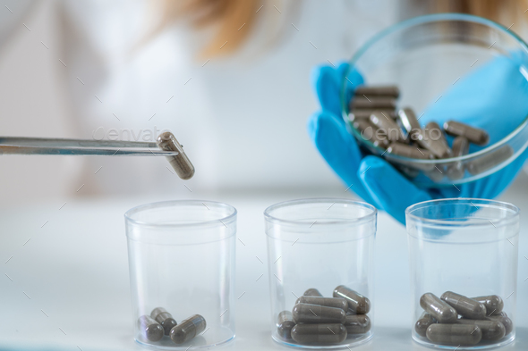 Medical innovation as a scientist meticulously prepares fecal transplant caps in the lab