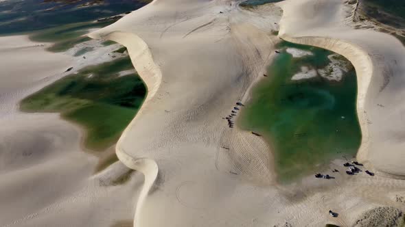Sand dunes mountains and rain water lagoons at northeast brazilian paradise. alt