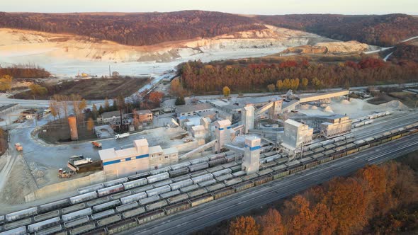Aerial View of Cargo Train Loaded with Crushed Sandstone Materials at Mine Factory alt
