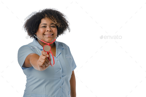 portrait of young Afro-Latin female doctor smiling, holding stethoscope drum at camera, copy space