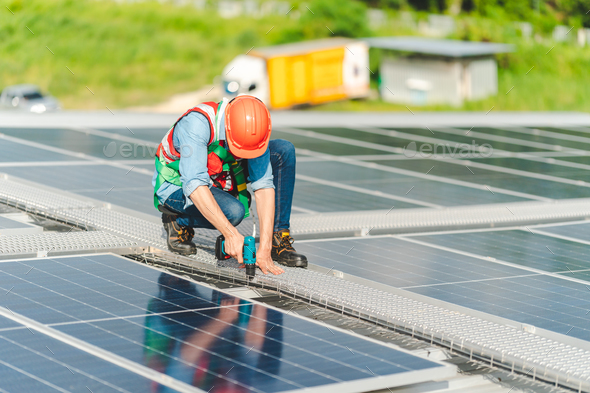 Male professional engineer installing solar photovoltaic panel system, Electrician technician job