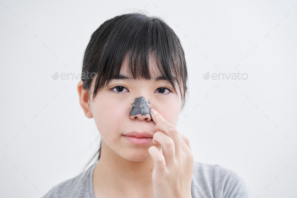 Japanese middle school girls applying a nose pack