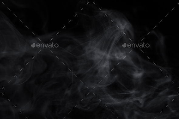 Swirling wriggling smoke steam isolated on a black background for