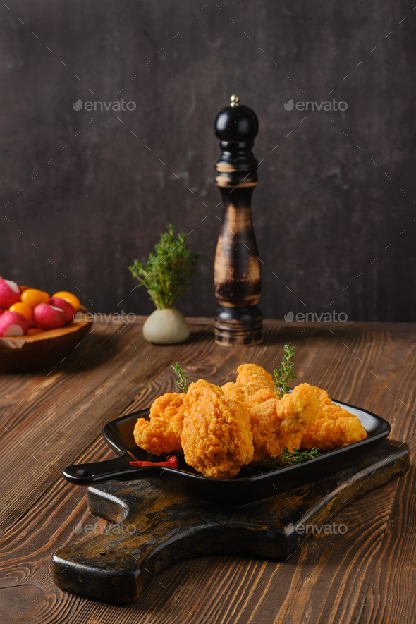 Hot and spicy deep fried breaded chicken wings Stock Photo by boomeart