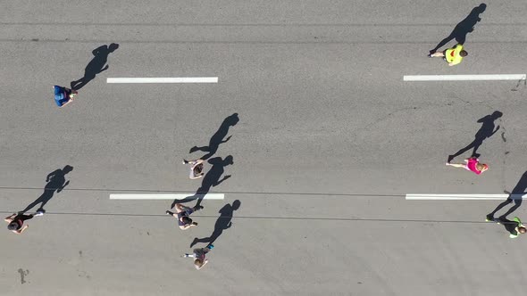 Aerial Group of Runners and Cyclist on City Road alt