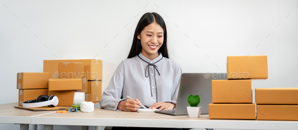 Woman entrepreneur working at home receive orders from online cu