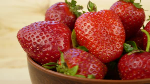 Juicy Red Ripe Strawberries in a Brown Plate