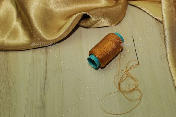 Spool of Green Thread with Needle Stock Photo - Image of yarn