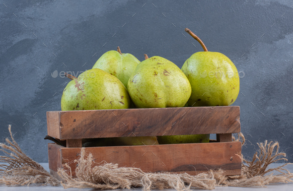 Fresh organic Ripe green apples box on wooden table Stock Photo by