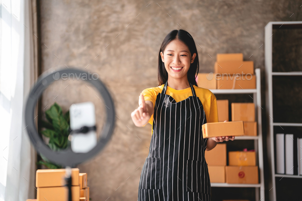 Small business parcel delivery concept, Female entrepreneur usin
