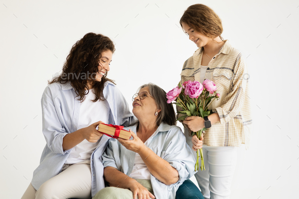 Elderly woman with gifts, Stock image