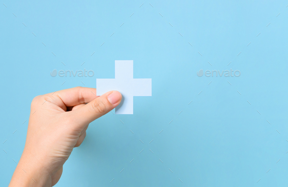 Hand holding plus icon for medical and health care concept, Access to welfare health, People with