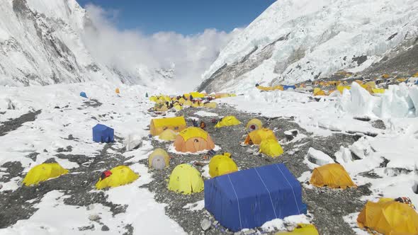 Sunny Day in the Himalayas Big Camp with Many Tents on the Way to the Top alt