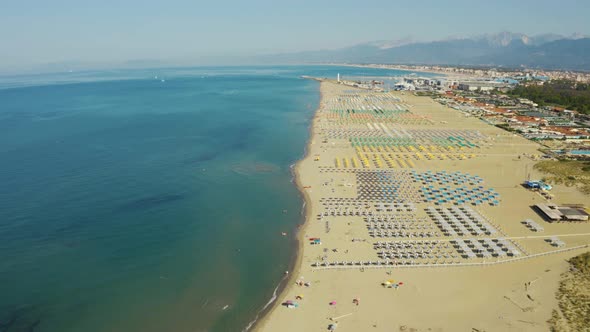 6069 Aerial, Large Sand Beach In The Morning In Viareggio, Italy