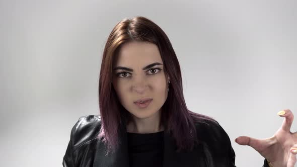 Portrait of Young Woman with Coloured Hair Trembling in Anger and Moving Hands alt