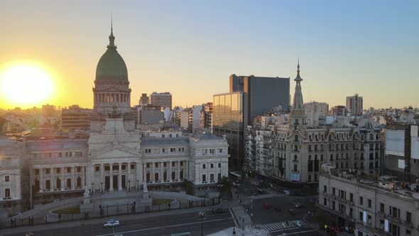 Aerial lowering on Congressional square and monument with Argentine Congress building in background alt