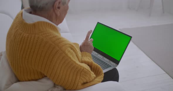 Elderly Woman Looks Monitor Green Screen Talks Via Video Link Her Granddaughter Daughter Doctor alt