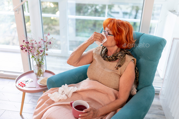 Elderly woman having flu