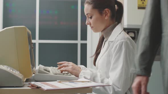 Female scientist working with a computer in the lab